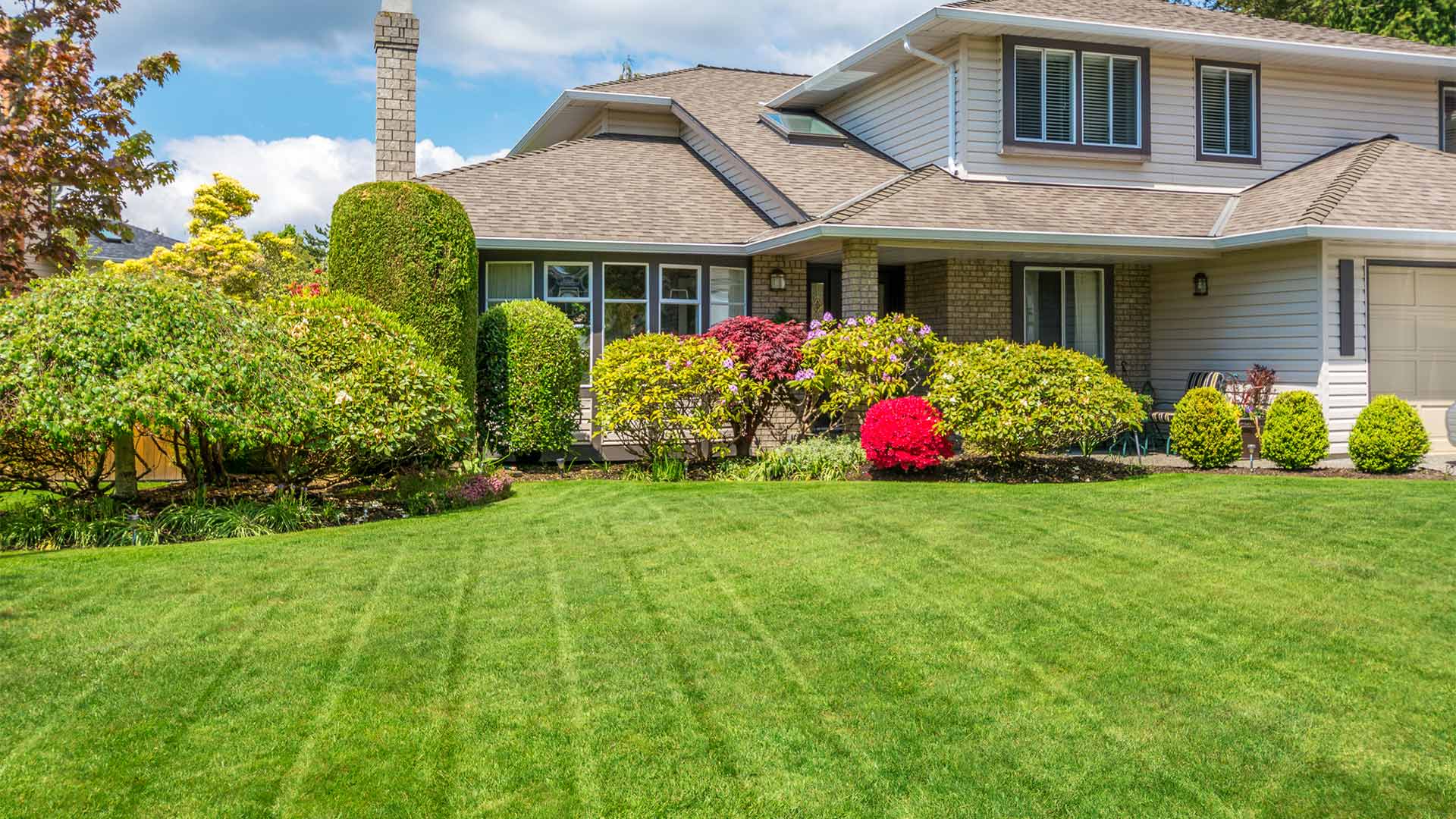 residential property exteriors with front yard lawn after maintenance shinnecock hills ny